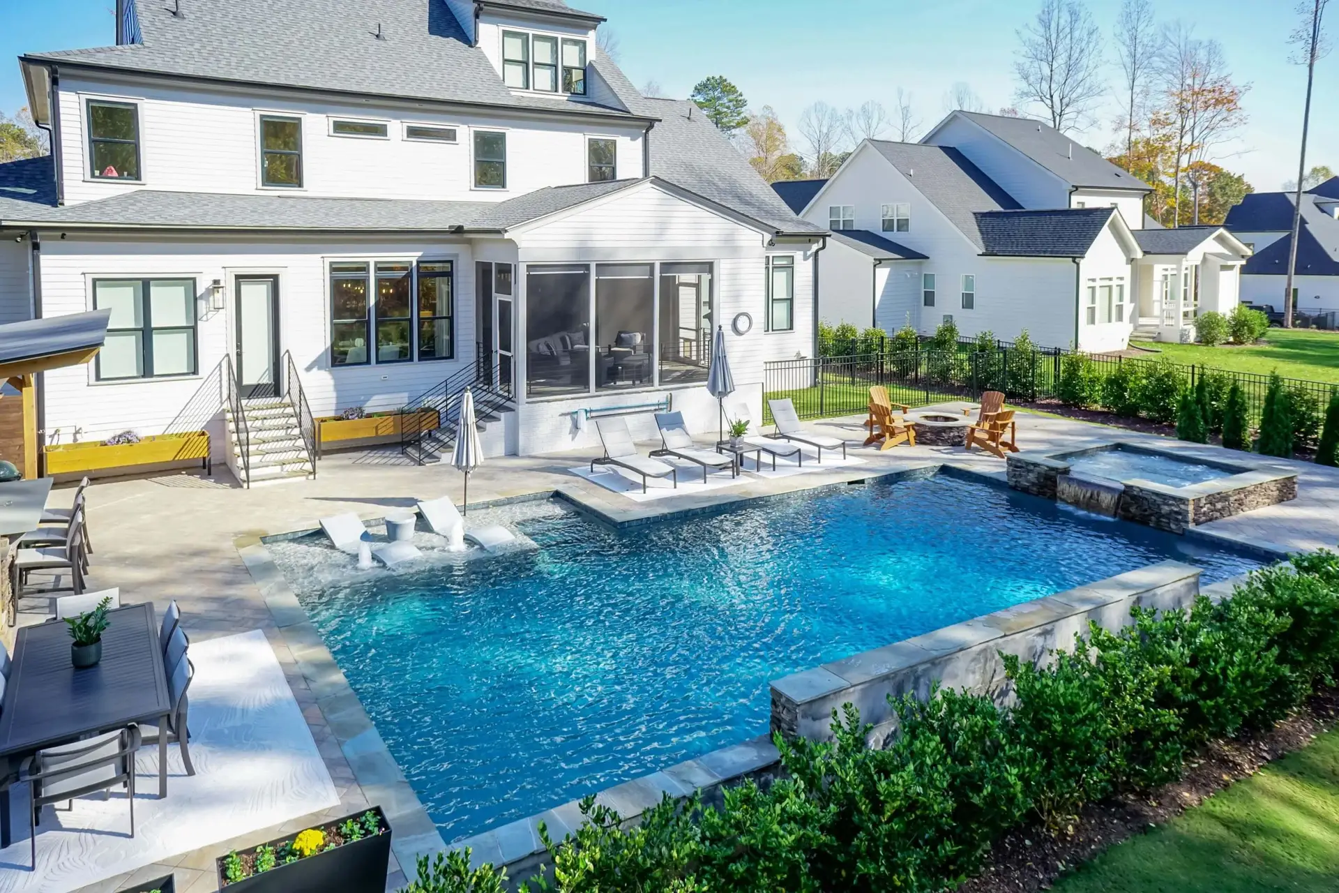 Raleigh, NC luxury rectangular pool with Cambridge pavers and lush landscaping