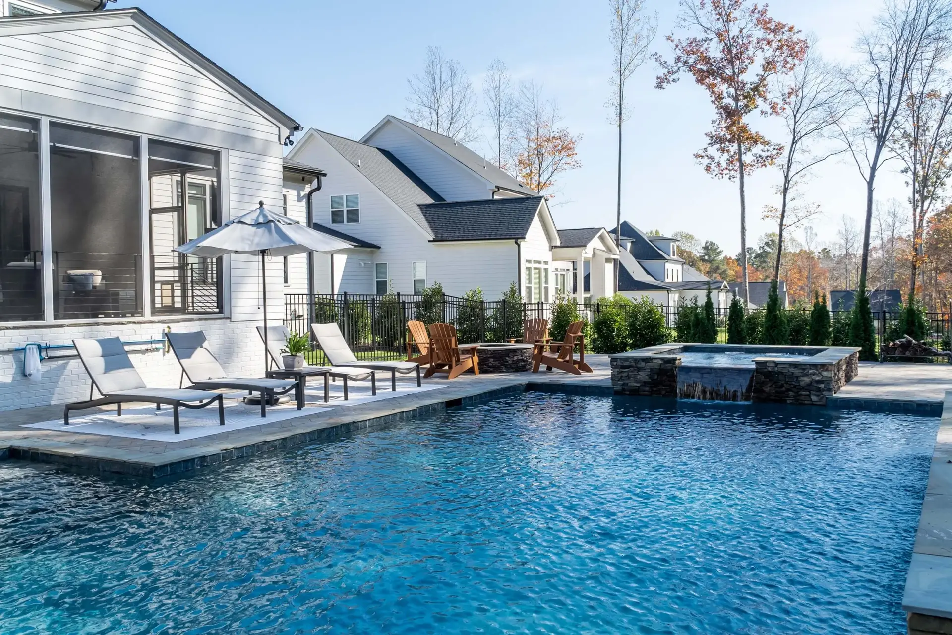 Rectangular pool in North Raleigh with spillover spa