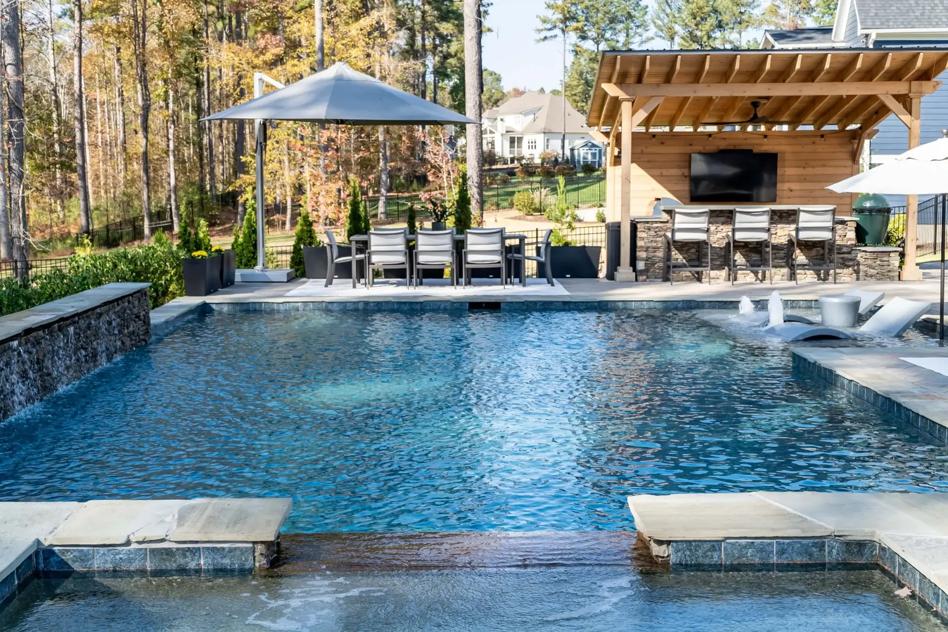 Linear pool and spa with pebbletec plaster in North Raleigh, NC