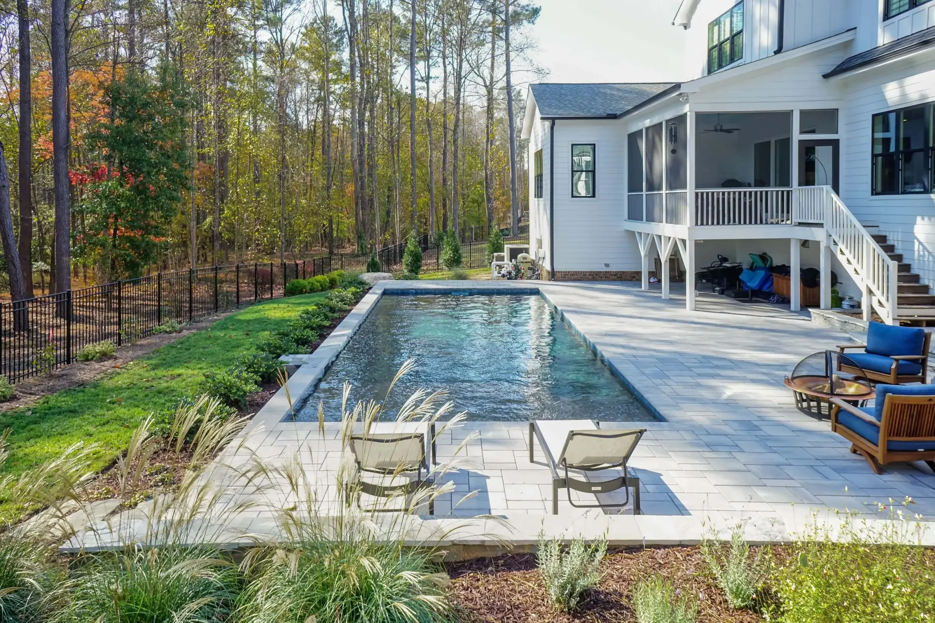 Wake Forest luxury linear pool with swim jet and Techo Bloc pavers