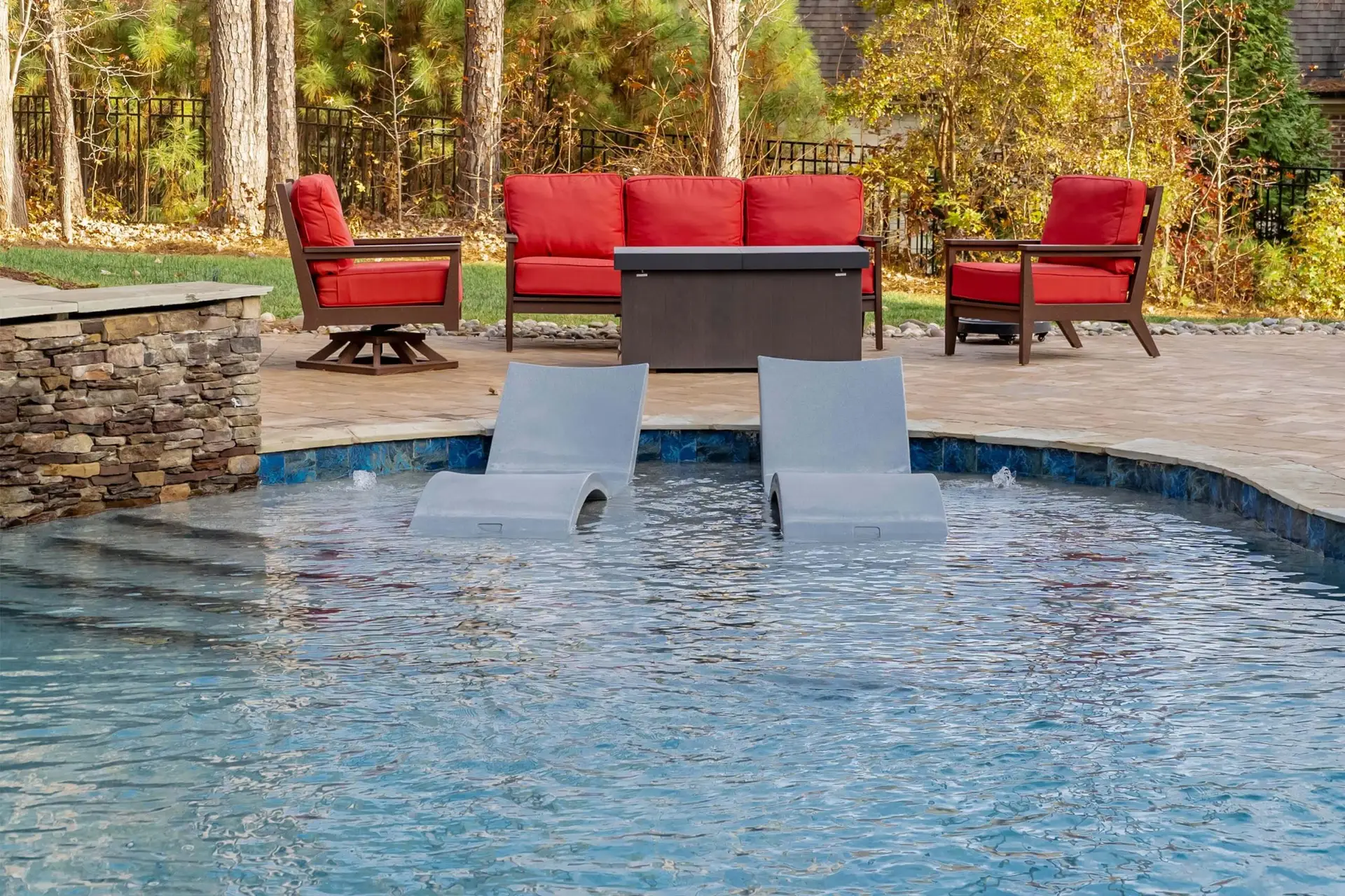 North Raleigh custom concrete pool with a baja shelf