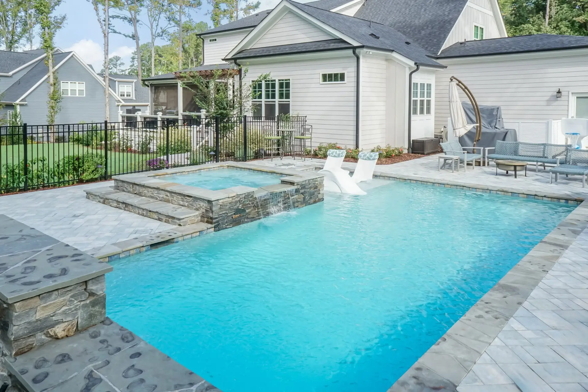 Toll Mill Vista Escape luxury spa with custom veneer and spill and linear pool in Raleigh, NC